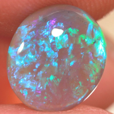 SOLID BLACK CRYSTAL OPAL Rolling flashes of green and turquoise fire in a 3D pattern